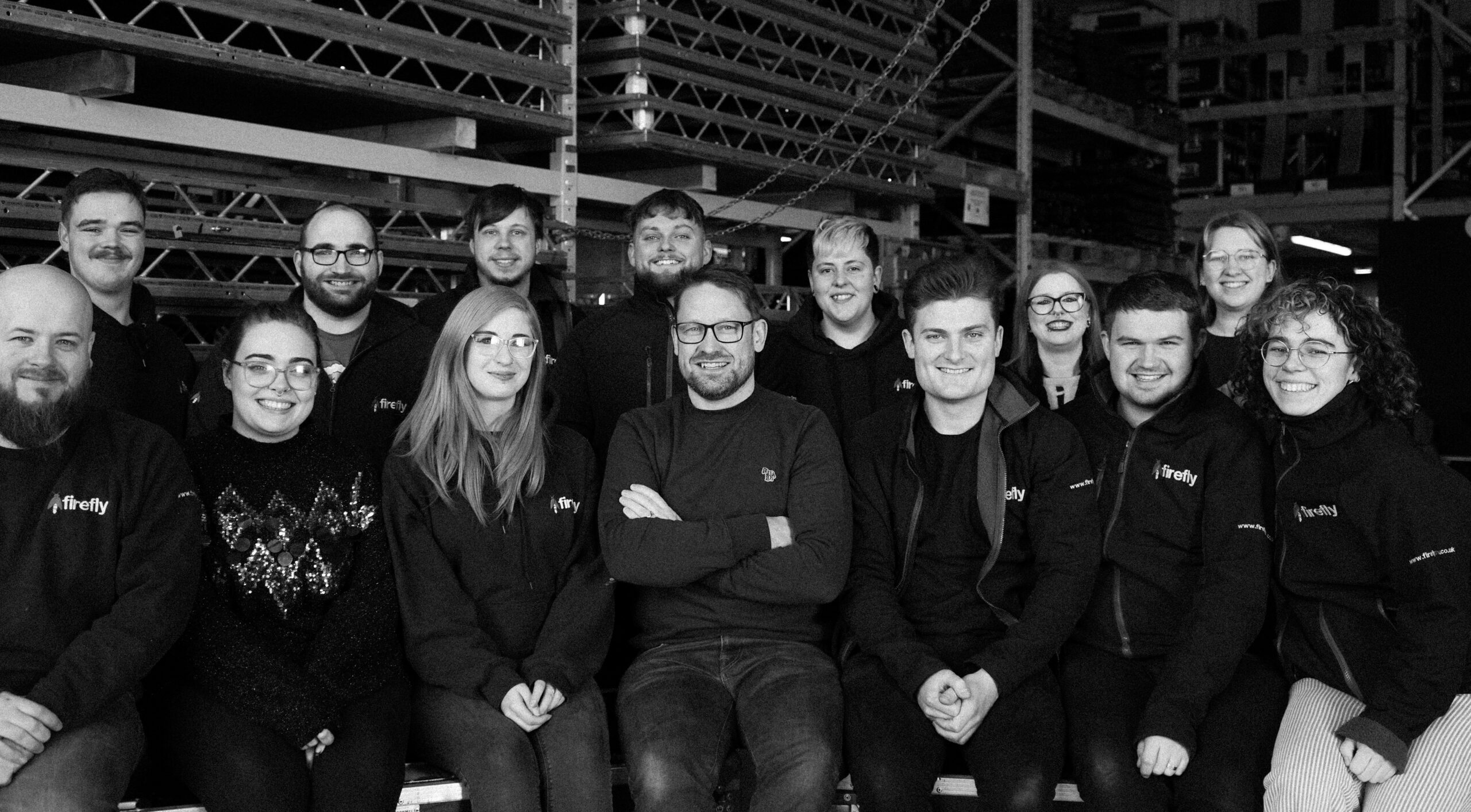 a group of people all smiling and looking happy