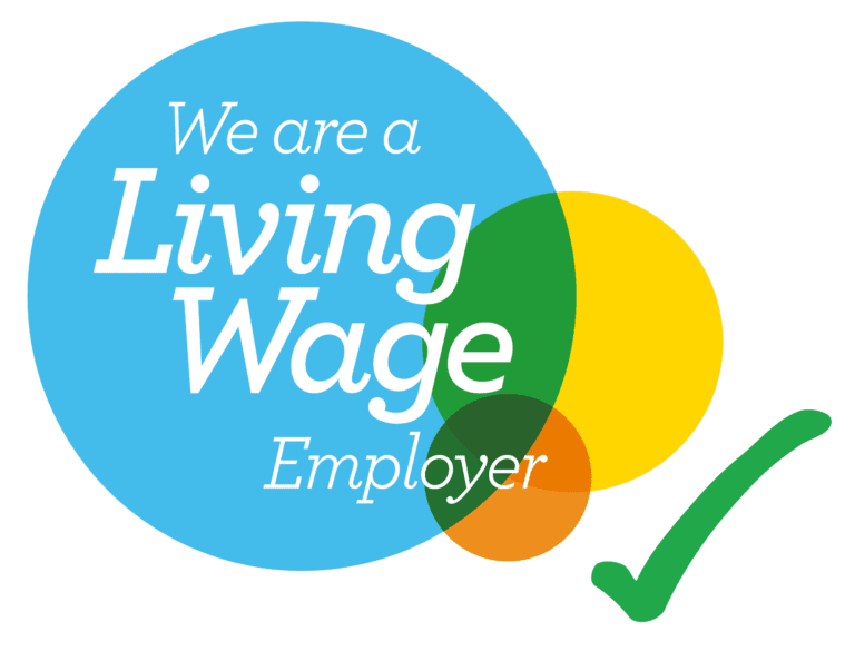 an image showcasing a living wage employer accreditation in a blue bubble which crosses over with an orange and yellow bubble with a green tick next to it