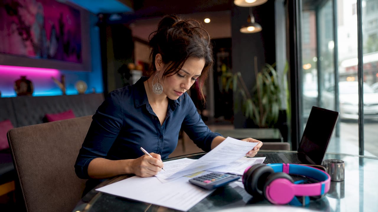 Event planner reviewing AV event insurance documents